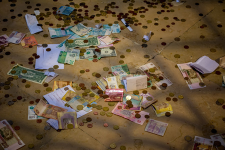 Horisontal View of Many Money and Coins of Different Countries on the Floorの写真素材