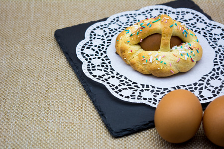 Horizontal View of Italian Baked Food Called Scarcella during Easter Celebrieties on a Black Square...