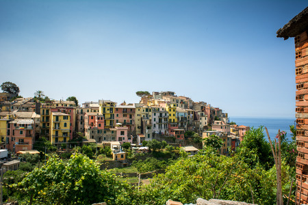 Horizontal View of the city of Corniglia  on Blue Sky and Sea Background in the Italian National Park of the Cinque Terre. Liguria, North of Italyの写真素材
