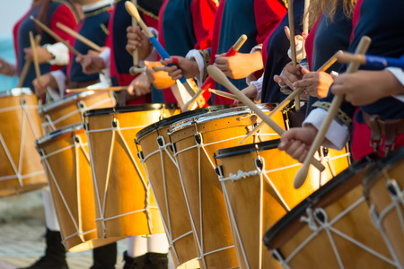 Group of Men Dressed in Medieval Clothes Playing Drums in Italyの写真素材