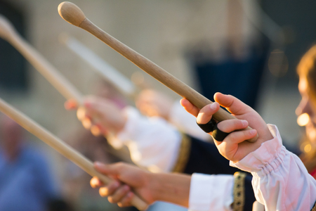 Close Up of Group of Drum-bats Directed Towards the Sky during a Manifestation in Medieval Clothes in Italyの写真素材