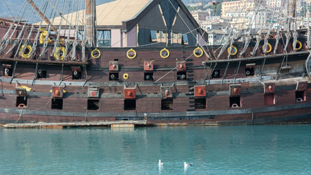 Horizontal View of the Starboard Side of an Ancient Pirate Galeon with the Hatches of the Cannons Open on Blur Backgroundのeditorial素材