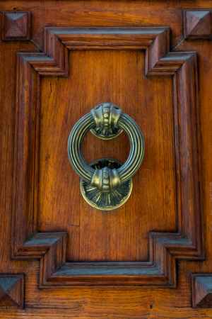 Old Clapper on Wooden Old Door. Copy Spaceの写真素材