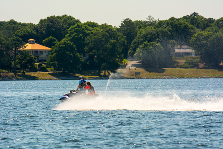 People Enjoying with Jet Boating at Sea in Florida on Blur Backgroundの写真素材