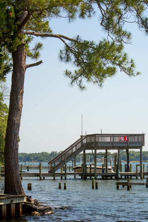 Panoramic View of Boat Lift in a Lake on Blur Background. Niceville, Floridaの写真素材