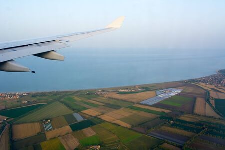 Aerial View of Italian Plantation Landscape in Tuscany taken from an Airplane in Flight