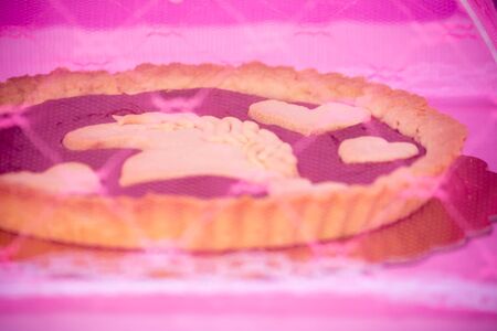 Close up of an Italian Chocolate Tart under Tulle Protection against Flies on Blurred Backgroundの写真素材