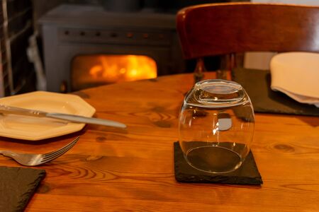 Set Table for Breackfast in English Cottage in Countryside on Blurred Wood Burning Stove on...