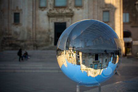 The Church of San Francesco Di Assisi in Matera enclosed in a Cristal Sphere on Blue Sky Background