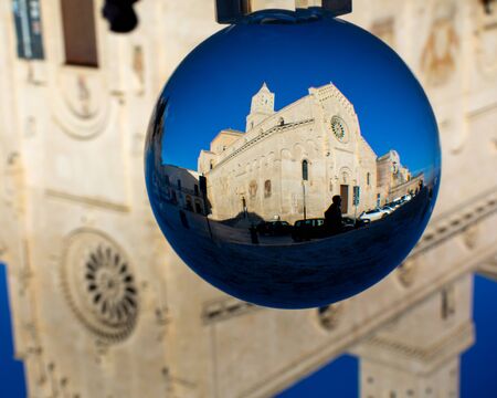 The Cathedral of Matera in a Cristal Sphere on Blue Sky Background. Cathedral of Madonna della Bruna e di Sant'Eustachioの写真素材