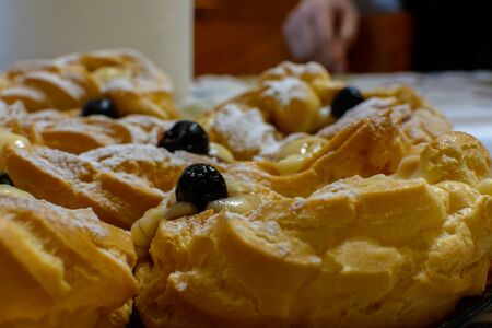 Close Up of Traditional Italian Food called Zeppole during Satin Joseph Celebration on Blurred Backgroundの写真素材