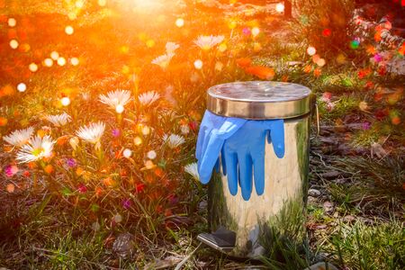 Girl thet leaves Blue Gloves at the End of Coronavirus Emergency on Blurred Background. Concept of...