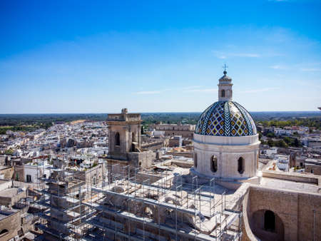 Aerial view of the Basilica Pontificia Cattedrale Santa Maria Assunta in Cielo in the town of Oria, in the south of Italy on Blurred backgroundの写真素材