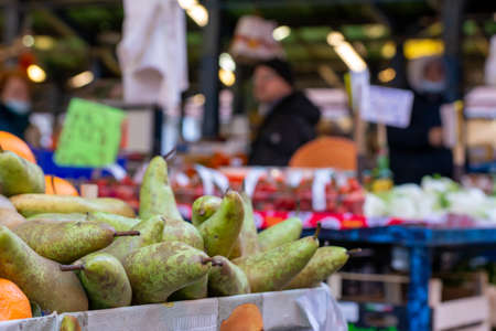 Close Up of Group of Fresh Pears at the Italian market on Blurred Background