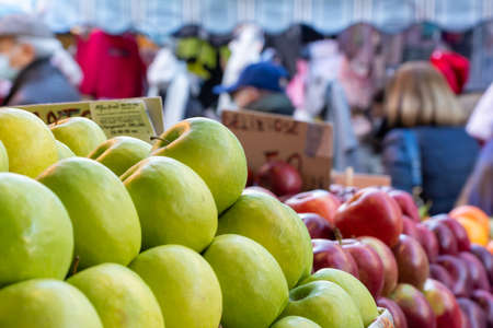 Close Up of a Group of Fresh Apples at the Italian Market on Blurred Background