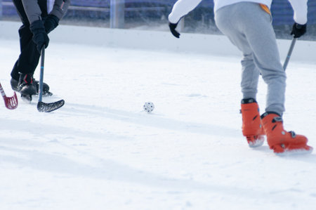 Close Up of Boys playing Ice Hockey on blurred background