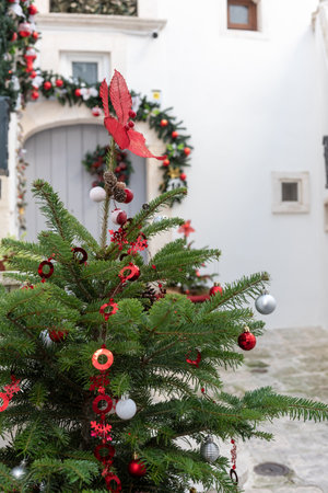 Close Up Of Decorated Christmas Tree In The Street Of Martina Franca, Near Taranto, In The South Of Italy On Blurred Backgroundの写真素材