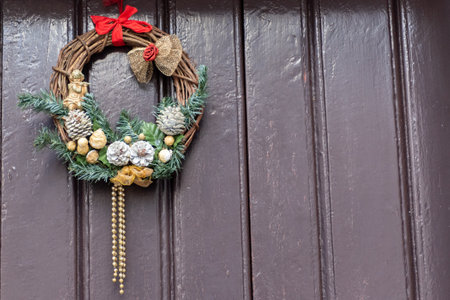 Christmas Decoration on a Beautiful Door in the Old Town of Martina Franca, Italy on Blurred Backgroundの写真素材