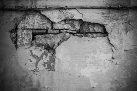 Broken Stone Wall In Greyscale In Martina Franca, Near Taranto, In The South Of Italy On Blurred Backgroundの写真素材
