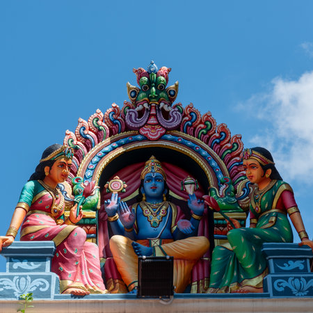 Hindu Deities Decoration On A Hindu Temple In The Chinatown District In Singapore On Blue Sky...