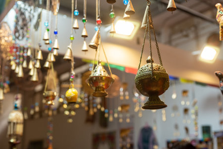 Selling Of Indian Souvenirs On A Stall At The Market On Blurred Backgroundの写真素材