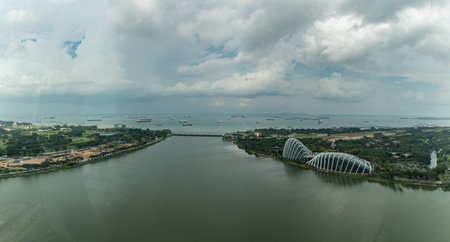 Panoramic View Of The Canalboat Of The City Of Singapore Taken By The Panoramic Wheel In A Cloudy Day On Blurred Backgroundの写真素材