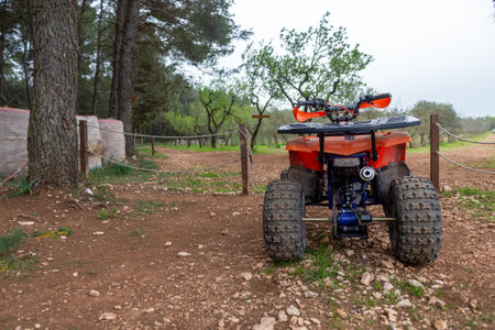 Red Quad Motorcycle in the Countryside on Blurred Bacokgroundの写真素材