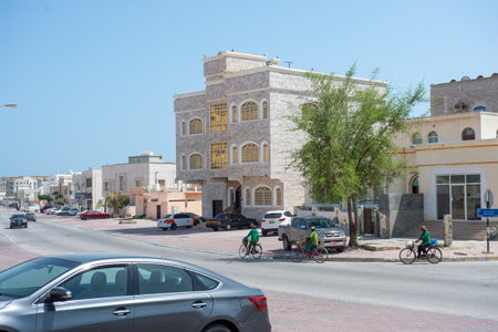 11 June 2024 - Salalah, Oman - People riding bicycles in the afternoon on a blurred backgroundの写真素材