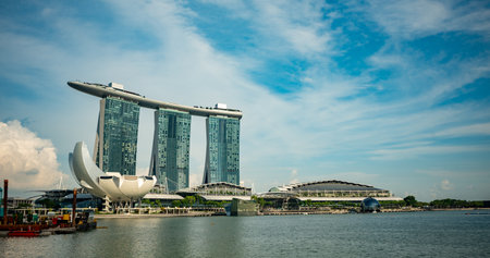 Panoramic View Of Marina Bay In Singapore In Summer On Blurred Partially Cloudy Sky Backgroundの写真素材