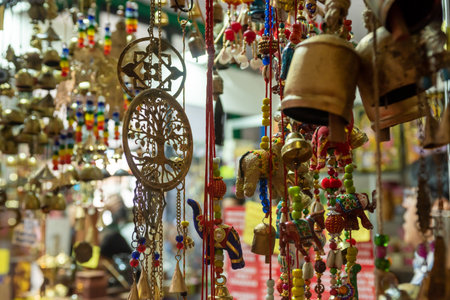 Selling Of Indian Souvenirs On A Stall At The Market On Blurred Backgroundの写真素材