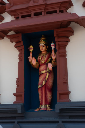 Hindu Statue Of Divinity Inside A Hindu Temple In Singapore On Blurred Background
