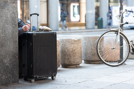Homeless Old Man Rubbing His Hands In The Cold In Winter On Blurred Backgroundの写真素材