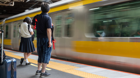 People Waiting At The Metro Station On Blurred Metro Train On Blurred Backgroundの写真素材