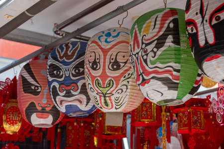 Colored Characterized Chinese Lamps in Front Of A Shop In Singapore On Blurred Backgroundの写真素材
