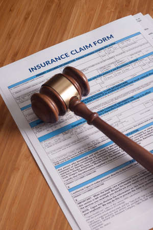 Claim form for a work injury on a desk topの写真素材