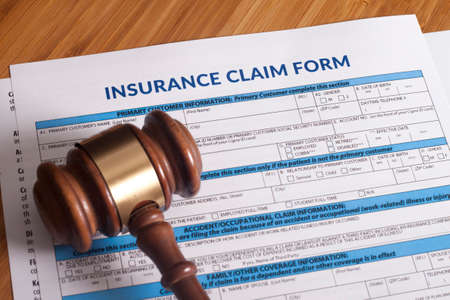 Claim form for a work injury on a desk topの写真素材