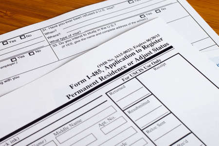 Form permanent US residence, someone filling out application formの写真素材