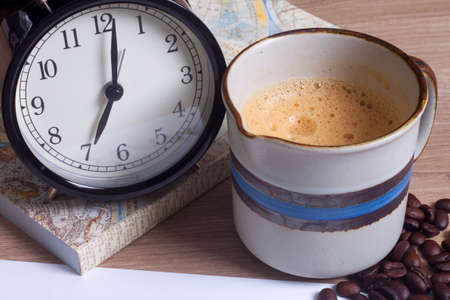 cup of coffee, clock and personal notebook closeup, coffee timeの写真素材