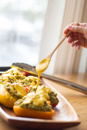 Tricolor Peppers stuffed with quinoa and avocado pesto