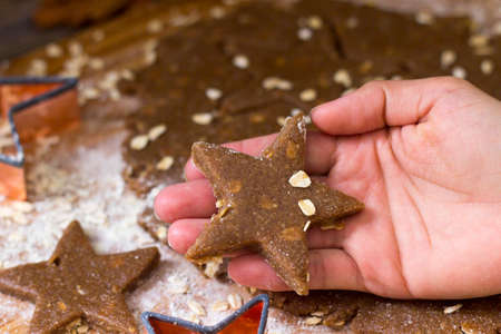 Mommy Making Star Oat Christmas Cookies in the kitchen before christmas for Santa