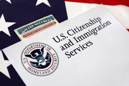 Logo U.S. Citizenship and Immigration Services, Social Security, Employment Autorization Card with United State of America flagの写真素材