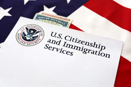 Logo U.S. Citizenship and Immigration Services, Social Security, Employment Autorization Card with United State of America flagの写真素材