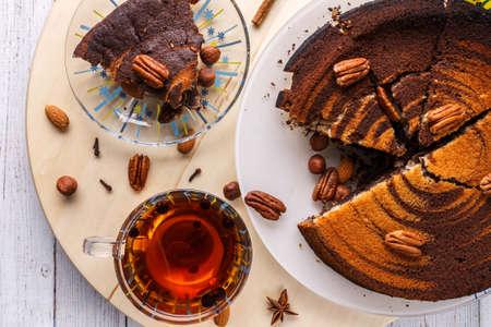 Pecan pie and tea top view on wooden backgroundの写真素材