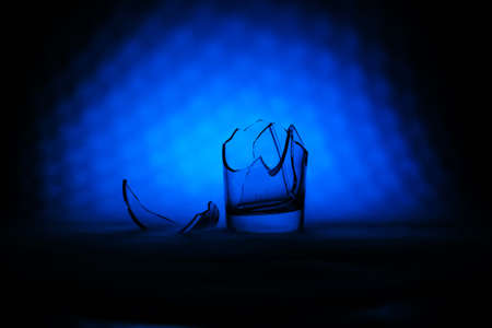 Broken glass in the color smokeの写真素材