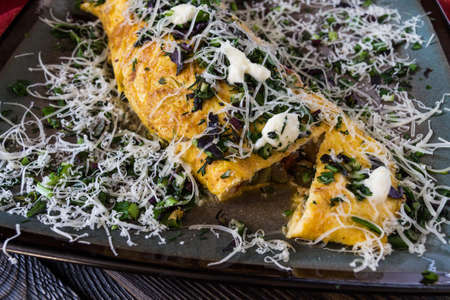 Italian cuisine - omelet with herbs and shallotsの写真素材