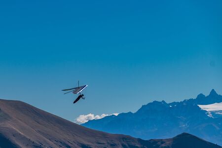 Hang-gliding in Swiss Alps from top of Rochers-de-Naye, near Montreux, Canton of Vaud, Switzerland.の写真素材
