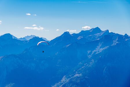 Hang-gliding in Swiss Alps from top of Rochers-de-Naye, near Montreux, Canton of Vaud, Switzerland.の写真素材