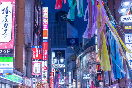 Tokyo, Shibuya, Japan - July 27, 2019: Night view of the Shibuya district, illuminated by a large number of billboards.のeditorial素材