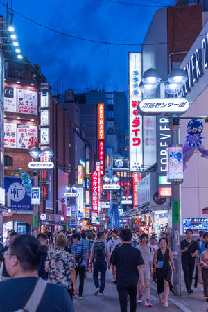 Tokyo, Shibuya, Japan - July 27, 2019: Portrait of Shibuya shopping district at night, Tokyo, Japan.