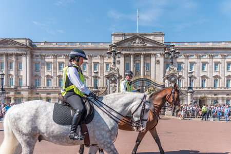 Policemen officers on horseback at the Royal Buckingham Palace during the changing the guardのeditorial素材